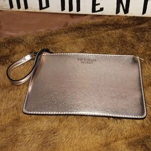 Victoria's secret gold make up bag or wallet.